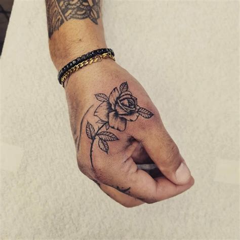 rose tattoo for men|small rose hand tattoo men.